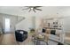 Open-concept living room showcases modern decor, a plush sofa, and seamless transition to the kitchen at 8918 Waxwing Way, Parrish, FL 34219