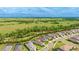 An aerial view of the property showcasing a community setting with green space and easy access to surrounding amenities at 10165 Canaveral Cir, Sarasota, FL 34241