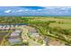 Aerial view of the property highlighting its location within a community near a lake, preserving natural Florida landscape at 10165 Canaveral Cir, Sarasota, FL 34241