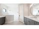 Modern bathroom features a frameless shower, large vanity, and updated fixtures at 10165 Canaveral Cir, Sarasota, FL 34241