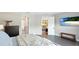 Bedroom showcasing the neutral interior, hardwood floors, and closet at 10165 Canaveral Cir, Sarasota, FL 34241