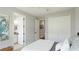 Comfortable bedroom with an ensuite bathroom, a closet, an octopus painting, and modern design at 10165 Canaveral Cir, Sarasota, FL 34241