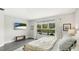 Bright bedroom showcasing the natural light and outdoor views at 10165 Canaveral Cir, Sarasota, FL 34241