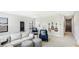 Entertainment bonus room featuring guitars on the wall, large windows and cozy seating area at 10165 Canaveral Cir, Sarasota, FL 34241