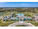 Beautiful community clubhouse featuring resort-style amenities, including a pool, lounge areas, and well-maintained grounds at 10165 Canaveral Cir, Sarasota, FL 34241