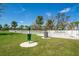 Spacious fenced dog park with convenient waste disposal stations and green grass for dogs to roam and play at 10165 Canaveral Cir, Sarasota, FL 34241