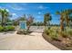 Welcoming entrance to the dog park with signage, landscaping, and secure fencing for off-leash fun at 10165 Canaveral Cir, Sarasota, FL 34241