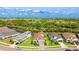 An aerial view showing the property situated on a well-maintained lot, featuring a landscaped yard at 10165 Canaveral Cir, Sarasota, FL 34241