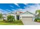 Charming single-Gathering home with an attached two car garage and a meticulously landscaped front yard at 10165 Canaveral Cir, Sarasota, FL 34241