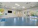 Spacious gym featuring a mirror wall, fitness equipment, and ample room for workouts at 10165 Canaveral Cir, Sarasota, FL 34241