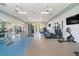Well-equipped fitness center with treadmills, elliptical machines, and weightlifting equipment at 10165 Canaveral Cir, Sarasota, FL 34241