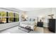Cozy bedroom with a neutral color scheme and a large window overlooking the backyard at 10165 Canaveral Cir, Sarasota, FL 34241