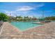 Large community pool featuring crystal clear water and an expansive pool deck with lounge seating at 10165 Canaveral Cir, Sarasota, FL 34241