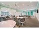 Inviting recreation room with tables, chairs, and ample space for socializing and activities at 10165 Canaveral Cir, Sarasota, FL 34241