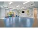 Bright yoga studio with natural light, a TV, and space for stretching and exercising at 10165 Canaveral Cir, Sarasota, FL 34241