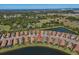 Breathtaking aerial view of a lakeside home within a well-planned community with stunning natural surroundings at 10230 Highland Park Pl, Palmetto, FL 34221