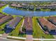 Aerial view of home showcasing well-manicured lawn and landscaping at 10230 Highland Park Pl, Palmetto, FL 34221