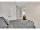 Comfortable bedroom featuring modern gray decor and ample closet space at 10230 Highland Park Pl, Palmetto, FL 34221