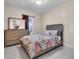 Well-lit bedroom featuring modern furnishings and neutral-toned decor at 10230 Highland Park Pl, Palmetto, FL 34221