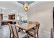 Open-concept dining area featuring a table with seating for six and seamless flow into the living spaces at 10230 Highland Park Pl, Palmetto, FL 34221