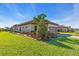 Well-maintained home featuring beautiful landscaping, a two-car garage, and a neatly manicured lawn at 10230 Highland Park Pl, Palmetto, FL 34221