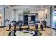 Modern gym with stationary bikes, weight machines, and motivational graphics at 10230 Highland Park Pl, Palmetto, FL 34221
