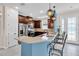 Kitchen with stainless steel appliances, breakfast bar, and plenty of counter space at 10230 Highland Park Pl, Palmetto, FL 34221