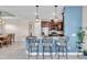 Kitchen bar with stylish pendant lighting and seating for three at 10230 Highland Park Pl, Palmetto, FL 34221