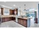 Spacious kitchen with stainless steel appliances, breakfast bar, and lake view at 10230 Highland Park Pl, Palmetto, FL 34221