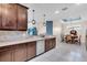 Kitchen area with stainless steel appliances and adjacent dining area at 10230 Highland Park Pl, Palmetto, FL 34221
