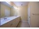 Bathroom featuring double sinks with long vanity and tile flooring at 10527 Falling Leaf Ct, Parrish, FL 34219