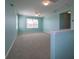 Bonus room with light blue walls, neutral carpet, and lots of natural light at 10527 Falling Leaf Ct, Parrish, FL 34219