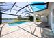 Enjoy the lanai and pool with a safety screen and lovely lake views at 10527 Falling Leaf Ct, Parrish, FL 34219