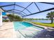 Relax by the pool overlooking the lake in this screened-in lanai at 10527 Falling Leaf Ct, Parrish, FL 34219