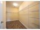 Walk-in closet featuring wire shelving and tile flooring at 10527 Falling Leaf Ct, Parrish, FL 34219
