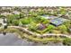 Aerial view of community park with playground, pickleball and tennis courts, and walking paths at 12711 Del Corso Loop, Bradenton, FL 34211