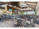 Interior view of the club bar featuring high ceilings, several TVs, tables and chairs at 12711 Del Corso Loop, Bradenton, FL 34211
