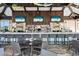 Interior view of the club bar featuring tables, chairs, televisions, and bar stools at 12711 Del Corso Loop, Bradenton, FL 34211