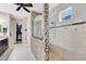Bathroom featuring dual sinks, walk in shower and walk in closet access at 12711 Del Corso Loop, Bradenton, FL 34211