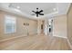 Unfurnished bedroom featuring light wood floors, a ceiling fan, and a large closet at 12711 Del Corso Loop, Bradenton, FL 34211