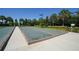 Outdoor bocce ball court with tropical landscaping, ample seating, and walking paths at 12711 Del Corso Loop, Bradenton, FL 34211