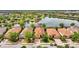 Beautiful single-Gathering home with terracotta roof tiles, surrounded by a lush green landscape and stunning water views at 12711 Del Corso Loop, Bradenton, FL 34211