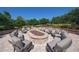 Beautiful stone fire pit featuring seating for large groups, great for outdoor entertaining at 12711 Del Corso Loop, Bradenton, FL 34211