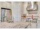 Close up of a kitchen featuring granite counters, stainless steel appliances, and white cabinets at 12711 Del Corso Loop, Bradenton, FL 34211