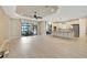 Spacious living room and kitchen with sliding doors to outdoor space, providing plenty of natural light at 12711 Del Corso Loop, Bradenton, FL 34211