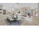 Open concept living room and dining area with modern decor and plenty of natural light at 12711 Del Corso Loop, Bradenton, FL 34211