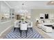 Dining room and living room combination with lots of seating and modern decor at 12711 Del Corso Loop, Bradenton, FL 34211