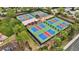 Overhead image of green and blue pickleball courts with a shaded pergola at 12711 Del Corso Loop, Bradenton, FL 34211