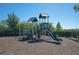 Community playground featuring a slide, climbing structure, and soft landing surface at 12711 Del Corso Loop, Bradenton, FL 34211