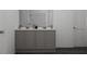 Bathroom featuring a dual sink vanity with gray cabinetry and a large mirror at 13040 Cedar Elm Lane, Parrish, FL 34219